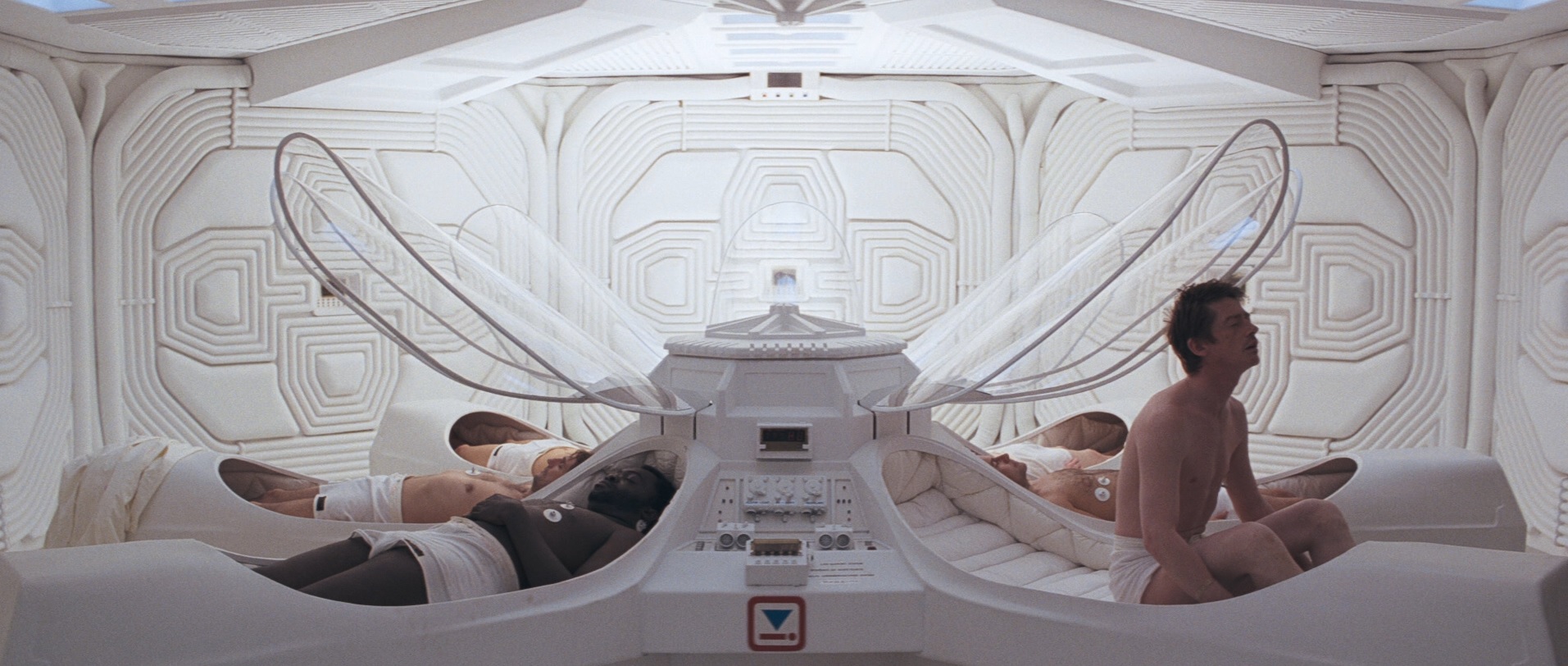 The crew of the Nostromo wakes up from their pods in a white room in Alien.