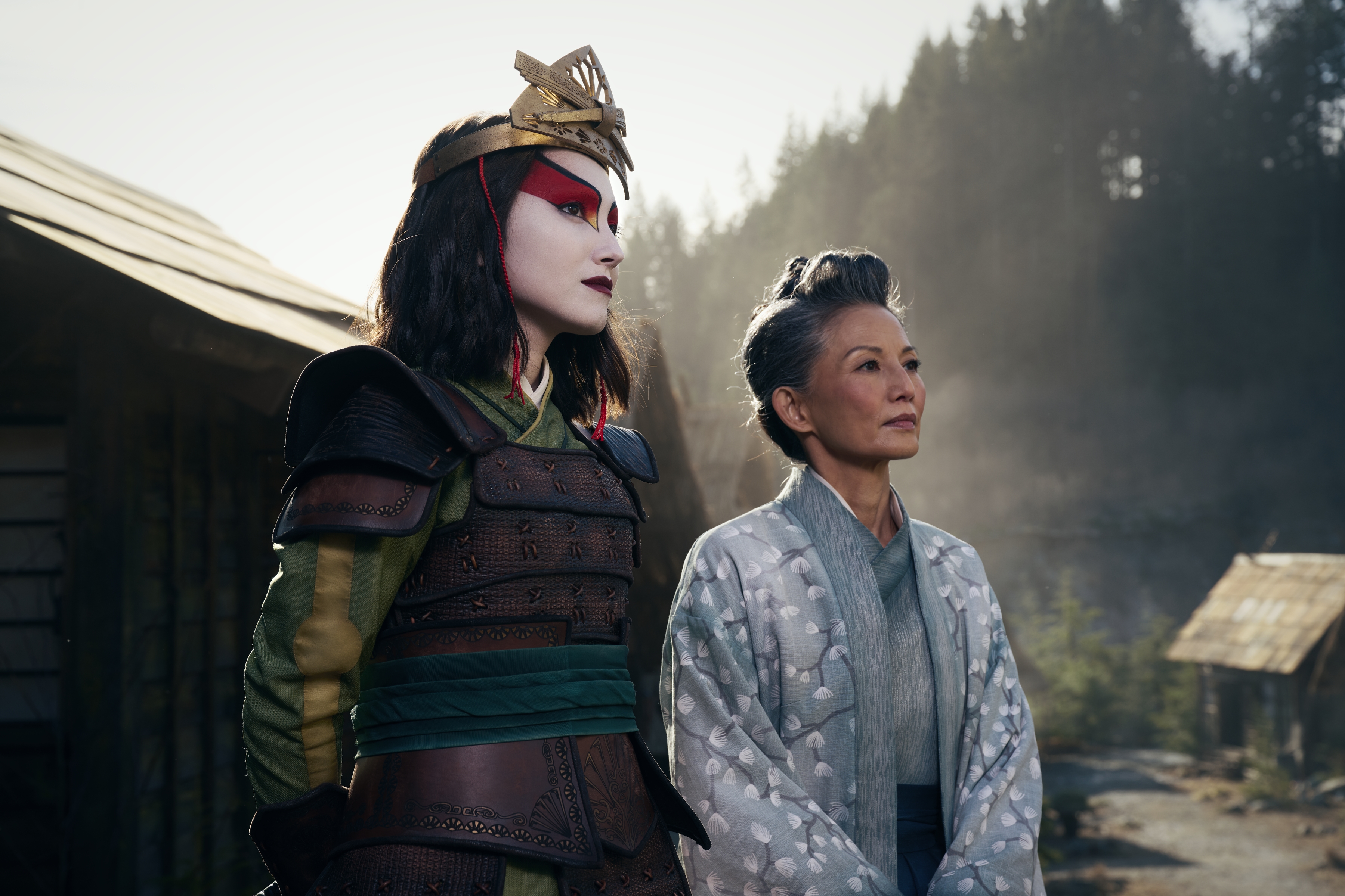 Suki from the live-action version of Avatar: The Last Airbender in full Kyoshi Warrior getup, standing next to Mayor Yukari